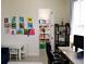Well-lit living room features a blue sofa, colorful artwork, and a tidy storage area at 2057 Celebration Blvd, Celebration, FL 34747