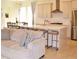 Bright living space featuring modern kitchen with stainless steel appliances and a comfortable seating area at 2057 Celebration Blvd, Celebration, FL 34747