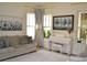 Cozy living room with a comfortable couch and a view of the white Yamaha piano at 2057 Celebration Blvd, Celebration, FL 34747