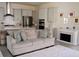 Inviting living room adjacent to a modern kitchen, featuring a fireplace and comfortable seating at 2057 Celebration Blvd, Celebration, FL 34747