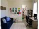 Comfortable living room features a blue sofa, bright artwork, and a view into an organized storage area at 2057 Celebration Blvd, Celebration, FL 34747
