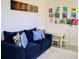 Inviting living room boasts a comfortable blue sofa, unique artwork, and a cozy atmosphere at 2057 Celebration Blvd, Celebration, FL 34747