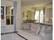 Comfortable couch with pillows, and a view to the dining room and white Yamaha piano at 2057 Celebration Blvd, Celebration, FL 34747