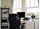 Bright office space with a large window, modern desk, and ample natural light at 2057 Celebration Blvd, Celebration, FL 34747