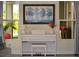 Bright room featuring a white Yamaha piano, complemented by elegant decor and natural light streaming through large windows at 2057 Celebration Blvd, Celebration, FL 34747