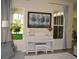 Bright room showcasing the white Yamaha piano, enhanced by decor and sunlight at 2057 Celebration Blvd, Celebration, FL 34747
