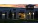 Exterior view of Island Village Elementary School at dusk, showcasing its modern architecture at 2057 Celebration Blvd, Celebration, FL 34747