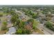 Residential neighborhood aerial view shows mature trees, paved streets, and well-maintained properties at 2081 N Normandy Blvd, Deltona, FL 32725