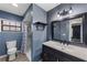 Modern bathroom with sink, vanity, walk-in shower, wood look flooring, and new fixtures at 2081 N Normandy Blvd, Deltona, FL 32725