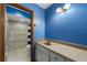 Bright bathroom featuring modern fixtures, vanity, and a shower with tiled wall at 2081 N Normandy Blvd, Deltona, FL 32725