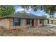 Charming brick home with blue shutters and a well-maintained lawn provides excellent curb appeal at 2081 N Normandy Blvd, Deltona, FL 32725