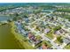 High angle neighborhood shot featuring community lakes and residences with private pools and clean energy solar at 2322 Queenswood Cir, Kissimmee, FL 34743