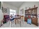 Cozy dining area with a round table, chairs, and a large china cabinet, perfect for Gathering meals at 2322 Queenswood Cir, Kissimmee, FL 34743