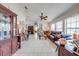 Spacious living room with neutral tile, ceiling fan, and plenty of space for furniture at 2322 Queenswood Cir, Kissimmee, FL 34743