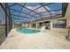 A beautiful screened in pool with a spacious deck, perfect for enjoying the outdoors in comfort at 2322 Queenswood Cir, Kissimmee, FL 34743