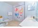 Bright bathroom boasting tile flooring, floral shower curtain, and a white vanity at 2610 Lodi Cir # 104, Kissimmee, FL 34746