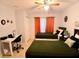 Comfortable bedroom featuring two beds, a desk area, neutral decor and tiled floor at 2610 Lodi Cir # 104, Kissimmee, FL 34746