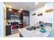 Modern kitchen with stainless steel appliances and granite countertops at 2610 Lodi Cir # 104, Kissimmee, FL 34746