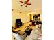 Open-concept living area flowing into a dining space with modern tile flooring at 2610 Lodi Cir # 104, Kissimmee, FL 34746