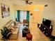 Bright living room with neutral tones, comfortable seating, and stylish accents at 2610 Lodi Cir # 104, Kissimmee, FL 34746