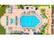 Aerial view of a community resort pool with sun loungers and a splash pad at 2610 Lodi Cir # 104, Kissimmee, FL 34746