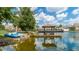 Scenic waterfront featuring a dock with paddle boats, community park, and picnic tables at 2610 Lodi Cir # 104, Kissimmee, FL 34746