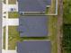 Aerial view of a neighborhood highlighting house roofs, driveways, and green spaces at 2872 Lingo Ln, Orlando, FL 32822