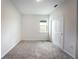 Bedroom featuring a neutral palette, plush carpeting, and a large window providing natural light and a serene atmosphere at 2872 Lingo Ln, Orlando, FL 32822