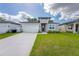 Beautiful single-story home featuring a well-manicured lawn and attached two-car garage at 2872 Lingo Ln, Orlando, FL 32822