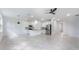 Modern kitchen featuring stainless steel appliances, white cabinets, and an island with a sink at 2872 Lingo Ln, Orlando, FL 32822