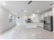 Bright kitchen with stainless steel appliances, white cabinets, and center island at 2872 Lingo Ln, Orlando, FL 32822