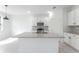 Bright kitchen with white cabinets, granite countertops, and a kitchen island at 2872 Lingo Ln, Orlando, FL 32822