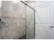 Elegant bathroom shower with sleek glass door and neutral tile work for a spa-like experience within the home at 2872 Lingo Ln, Orlando, FL 32822
