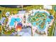 Aerial view of resort-style pools, lazy river, and mini golf course at 3120 Paradox Cir # 302, Kissimmee, FL 34746