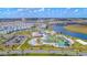 An aerial view shows community amenities with a pool, mini golf and clubhouse surrounded by residences at 3120 Paradox Cir # 302, Kissimmee, FL 34746