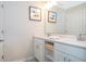 Bathroom featuring a vanity with double sinks, ample storage, and modern fixtures at 3120 Paradox Cir # 302, Kissimmee, FL 34746