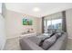 Comfortable living room with a gray sectional sofa, TV, and a sliding door to a balcony at 3120 Paradox Cir # 302, Kissimmee, FL 34746