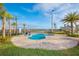 Private pool area with surrounding patio and lush landscaping at 3120 Paradox Cir # 302, Kissimmee, FL 34746