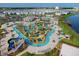 Aerial view of community featuring pools, lazy river, water slides, and a miniature golf course at 4213 Paragprah St, Kissimmee, FL 34746