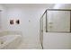 Bright primary bathroom with soaking tub, separate shower and spa-like wall decor at 4213 Paragprah St, Kissimmee, FL 34746