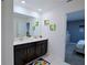 Bathroom with double sinks, contemporary vanity, and modern fixtures at 4213 Paragprah St, Kissimmee, FL 34746