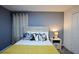 Comfortable bedroom with neutral tones, stylish decor, and a queen size bed at 4213 Paragprah St, Kissimmee, FL 34746