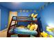 Bright bedroom with Minion themed bunk beds and cheerful decor at 4213 Paragprah St, Kissimmee, FL 34746