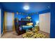 Kid-friendly bedroom with playful Minion decor, bunk beds, and bright, cheerful colors at 4213 Paragprah St, Kissimmee, FL 34746