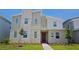 Charming two-story home with a stone accent wall and well-maintained landscaping at 4213 Paragprah St, Kissimmee, FL 34746