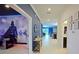 Bright, modern hallway with beautiful tile floors connecting to living spaces at 4213 Paragprah St, Kissimmee, FL 34746