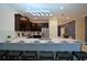Well-equipped kitchen with island seating and stainless steel appliances at 4213 Paragprah St, Kissimmee, FL 34746