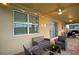 Outdoor patio area featuring furniture, string lights, ceiling fans, and sliding glass doors at 4213 Paragprah St, Kissimmee, FL 34746