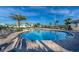 Enjoy this community pool with ample lounge seating, umbrellas, and lush landscaping at 4213 Paragprah St, Kissimmee, FL 34746