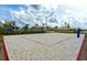 Well-maintained sand volleyball court with net and boundary markers, ready for a game at 4213 Paragprah St, Kissimmee, FL 34746